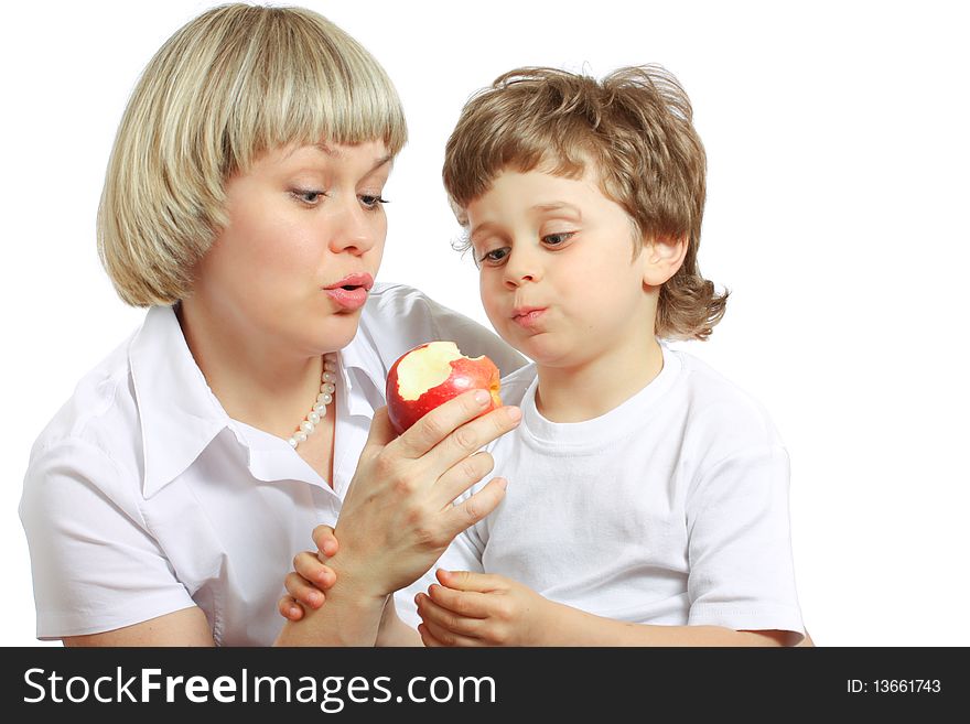 Woman and little boy playing and eating an apple. Woman and little boy playing and eating an apple