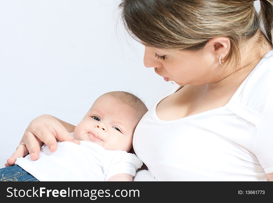 Happy family: mother and baby - playing and smiling. Happy family: mother and baby - playing and smiling