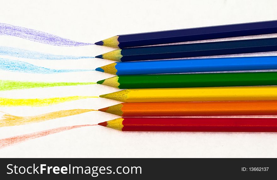 Crayons with drawn trace from them on the white background. Crayons with drawn trace from them on the white background