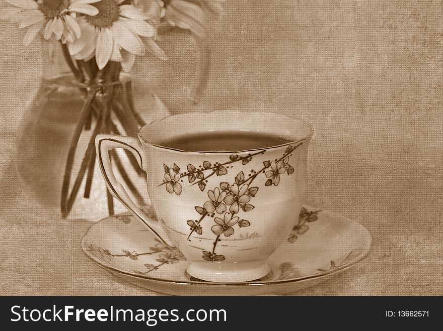 Vintage tea set with daisy bouquet in sepia tones. Vintage tea set with daisy bouquet in sepia tones.