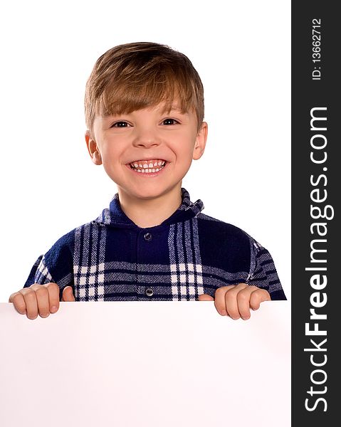 Funny little boy holding a blank white sign for your message. Good for borders of articles or websites. Beautiful caucasian model. Isolated on white background.