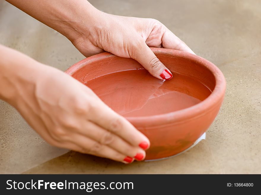 Clay Red Bow Holding By Beautiful Hand