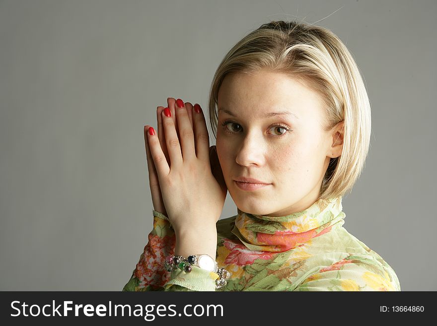 The beautiful young girl-blonde in a light green blouse. The beautiful young girl-blonde in a light green blouse