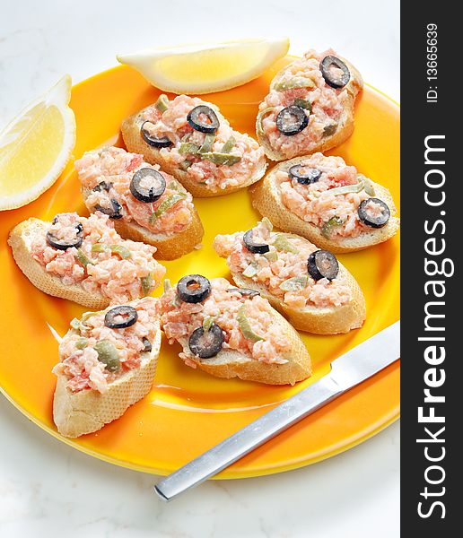 Salmon tartare with capers and black olives