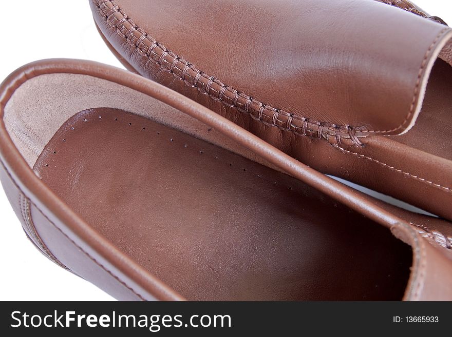 Male shoes. Modern brown elegant leather men shoues isolated on white. Male shoes. Modern brown elegant leather men shoues isolated on white.