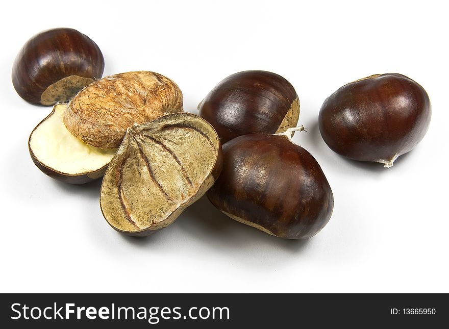 Edible chestnuts (castanea sativa) isolated on white