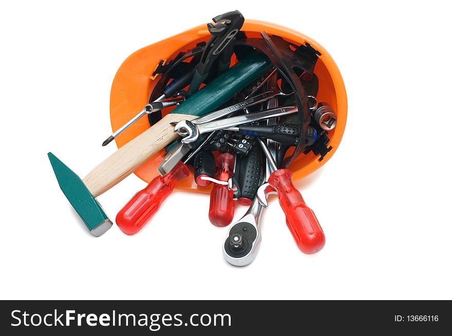 Building tools in an orange helmet isolated over white