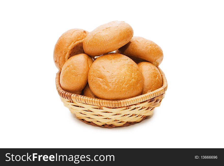 Rolls in a wattled basket isolated on white