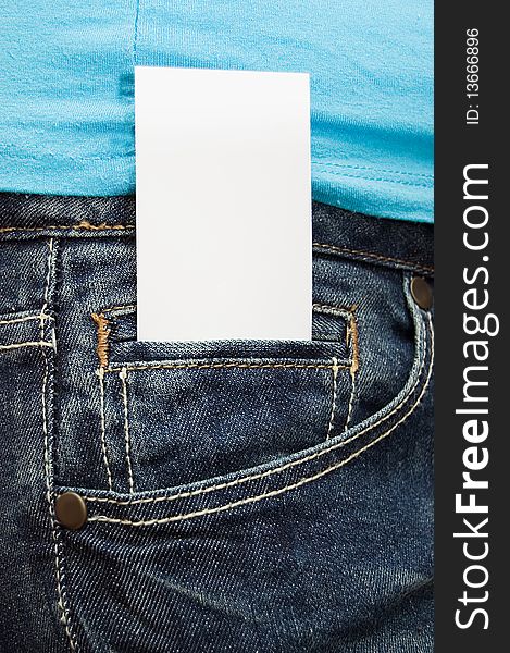 Blank business card in jeans pocket close up