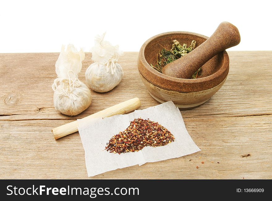 Herbal preparation and ingredients on a wooden board. Herbal preparation and ingredients on a wooden board