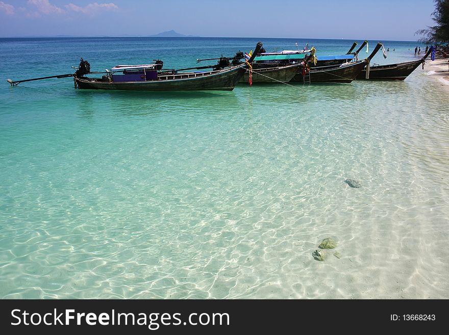 Traditional boat in the blue sea. Traditional boat in the blue sea