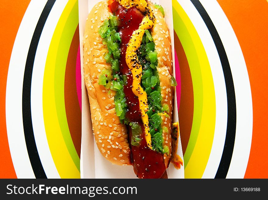 Tasty and sizzling hot dog with colorful background. Tasty and sizzling hot dog with colorful background.