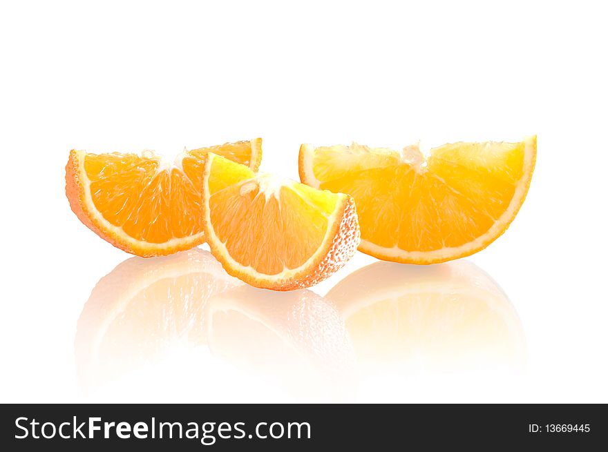 Pieces of orange on a white background