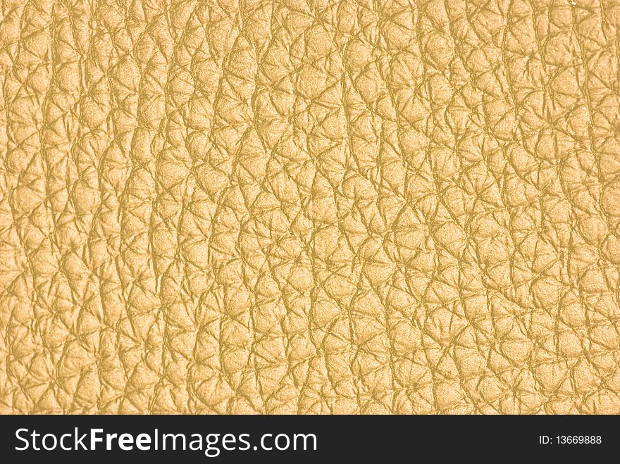 Closeup of beige leather used for upholstery and fashion accessories