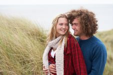 Teenage Couple Walking Through Sand Dunes Royalty Free Stock Photography Teenage Couple Walking Through Sand Dunes Royalty Free Stock Photography