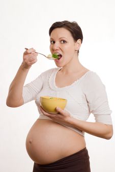 Pregnant Woman Eats Vegetables On White Background Royalty Free Stock Photo Pregnant Woman Eats Vegetables On White Background Royalty Free Stock Photo