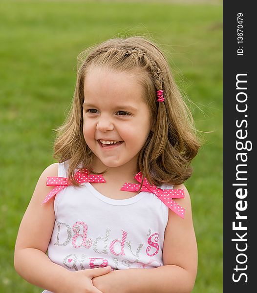 Little Girl Playing Outside With Big Smile