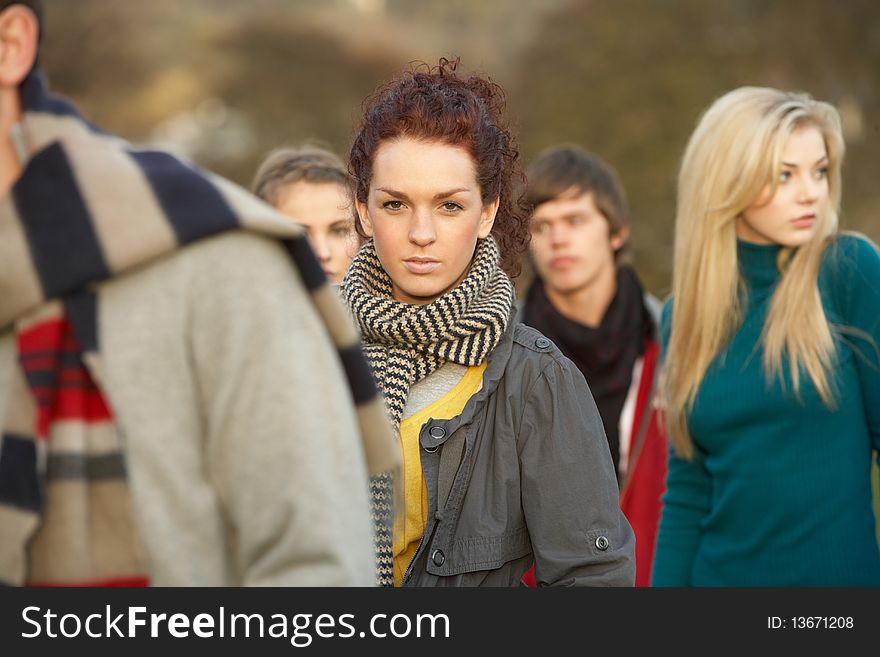Teenage Girl Surrounded By Friends