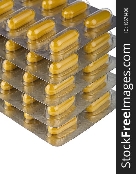 Stacked packs of pills isolated on white