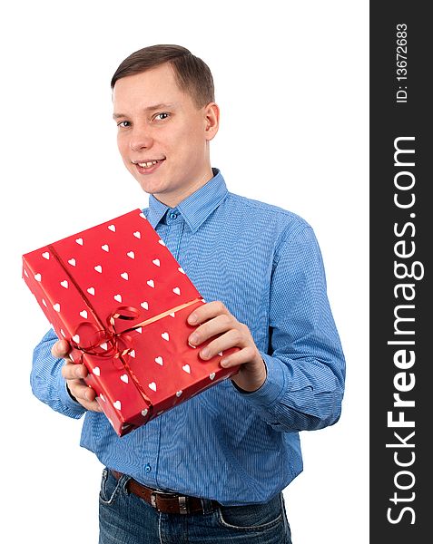 Young man with a gift box isolated over white