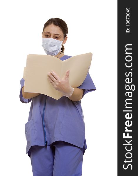 Female doctor reading a patient's chart. Female doctor reading a patient's chart