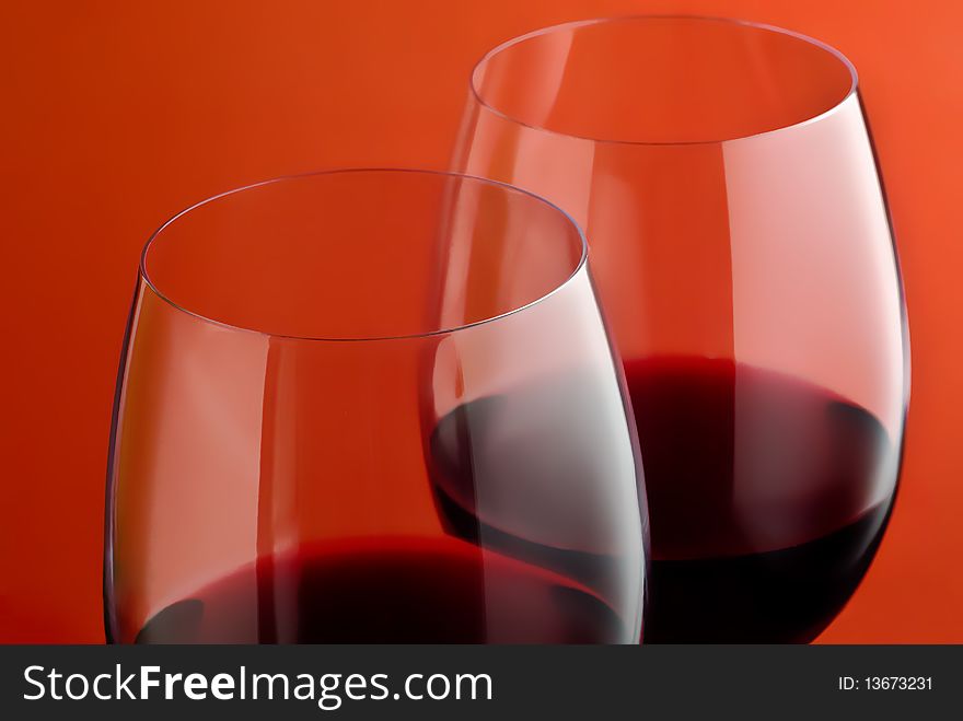 Two wineglass on a red background. Two wineglass on a red background