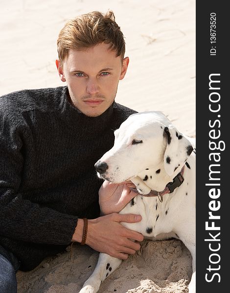 Teenage Boy On Beach With Dog