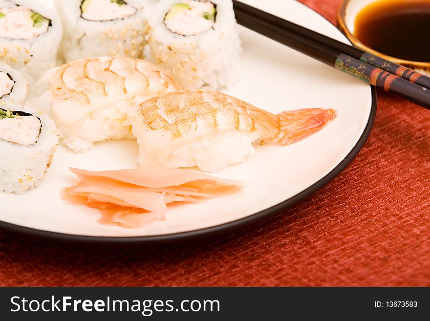 Plate of shrimp sushi with California rolls. Plate of shrimp sushi with California rolls