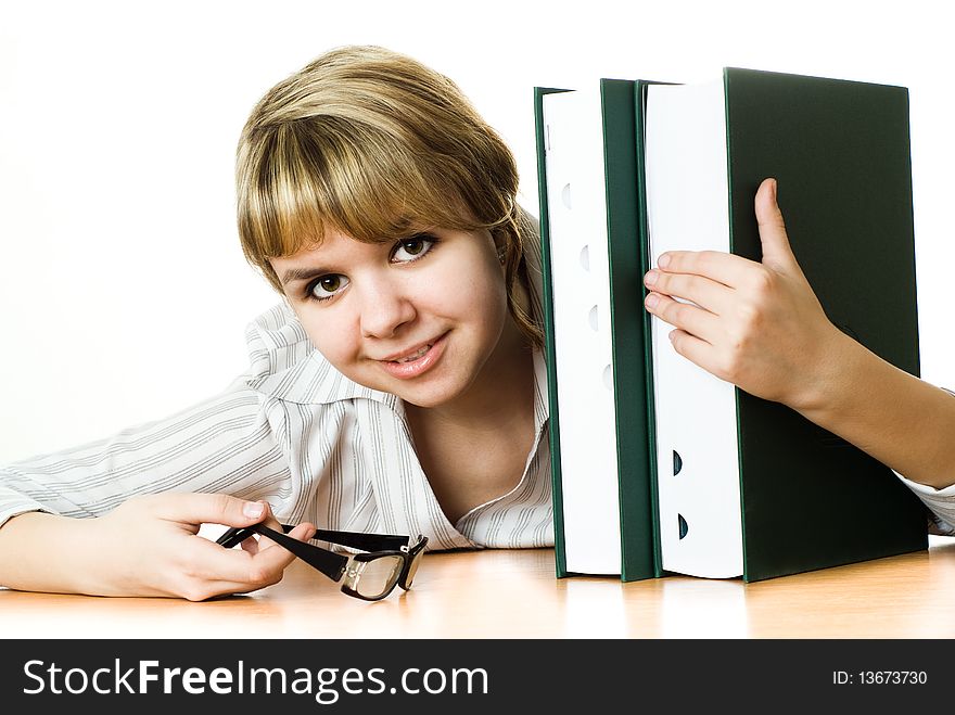 Young student with a book on white