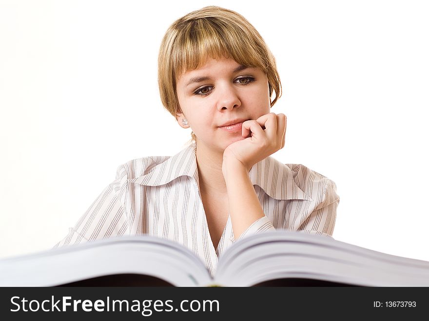 Beautiful young girl with a book on white