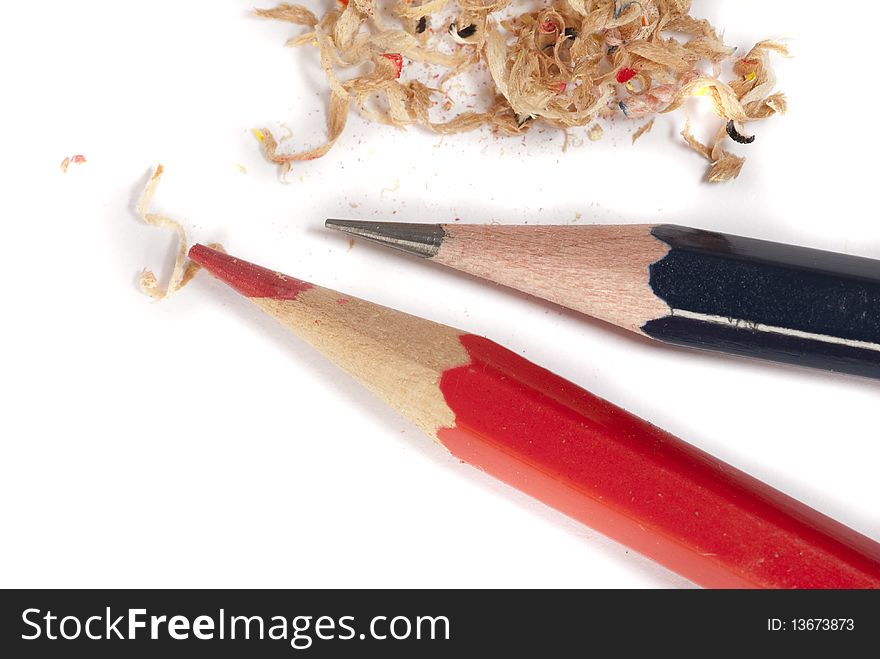 Closeup of lead pencil and red pencil along with shavings. Closeup of lead pencil and red pencil along with shavings