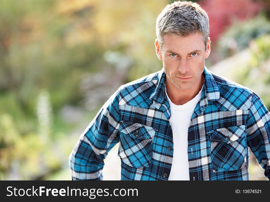 Portrait Of Man Standing Outside In Autumn