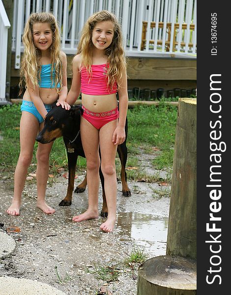 Shot of sisters with a dog. Shot of sisters with a dog