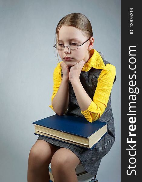 Little pupil  girl with books