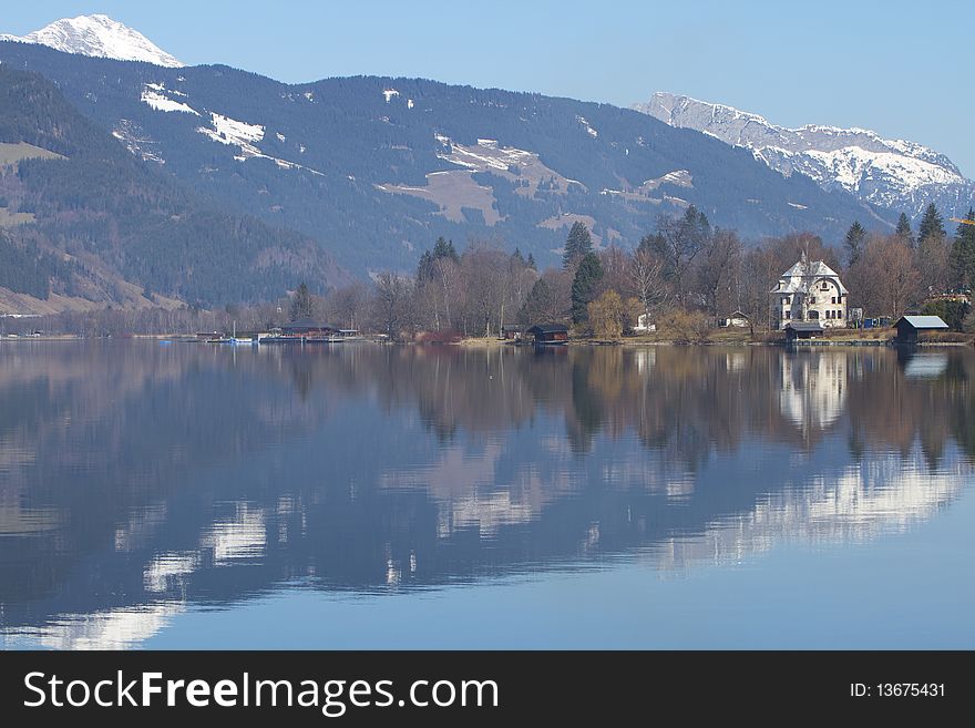 Reflections on a mountain lake at Zell am See, Austria, Europe