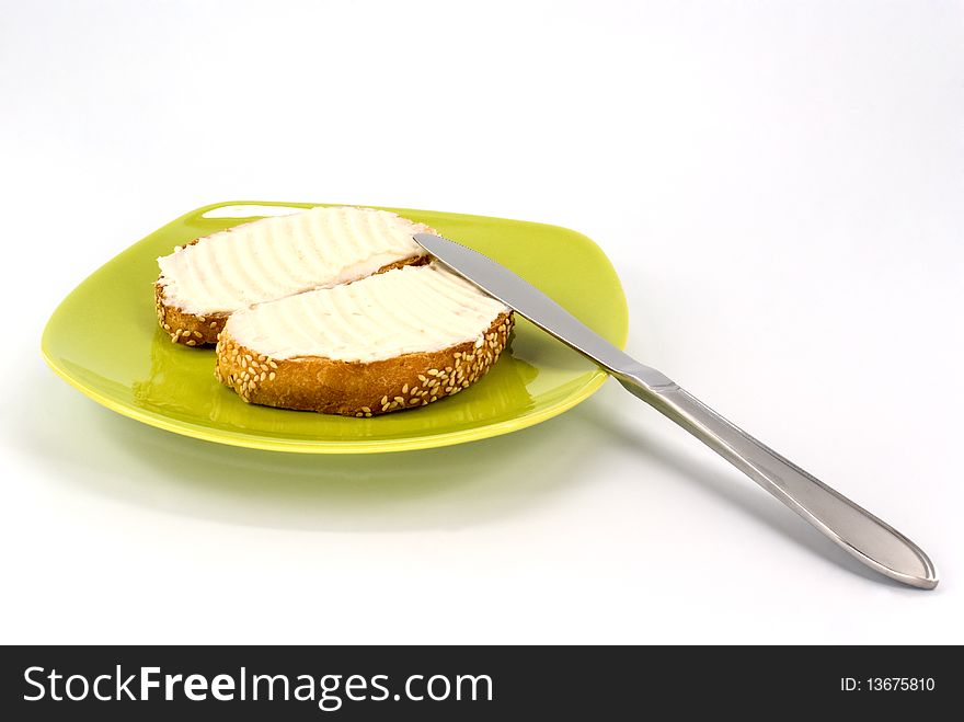 Toasted piece of bread with butter on plate