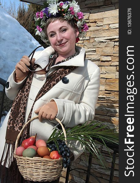 A girl wearing a crown with Easter basket