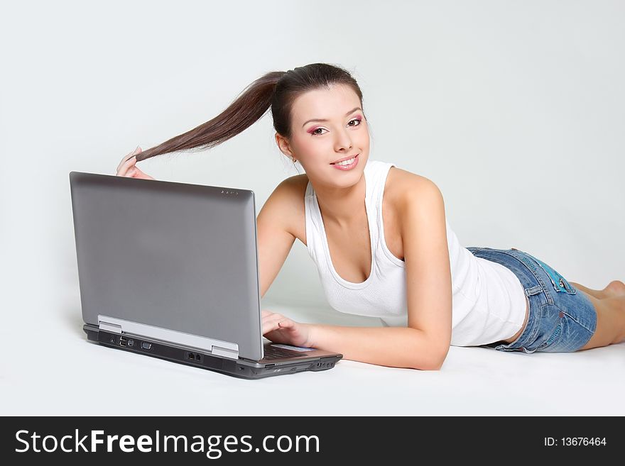 Young attractive girl with laptop. Young attractive girl with laptop