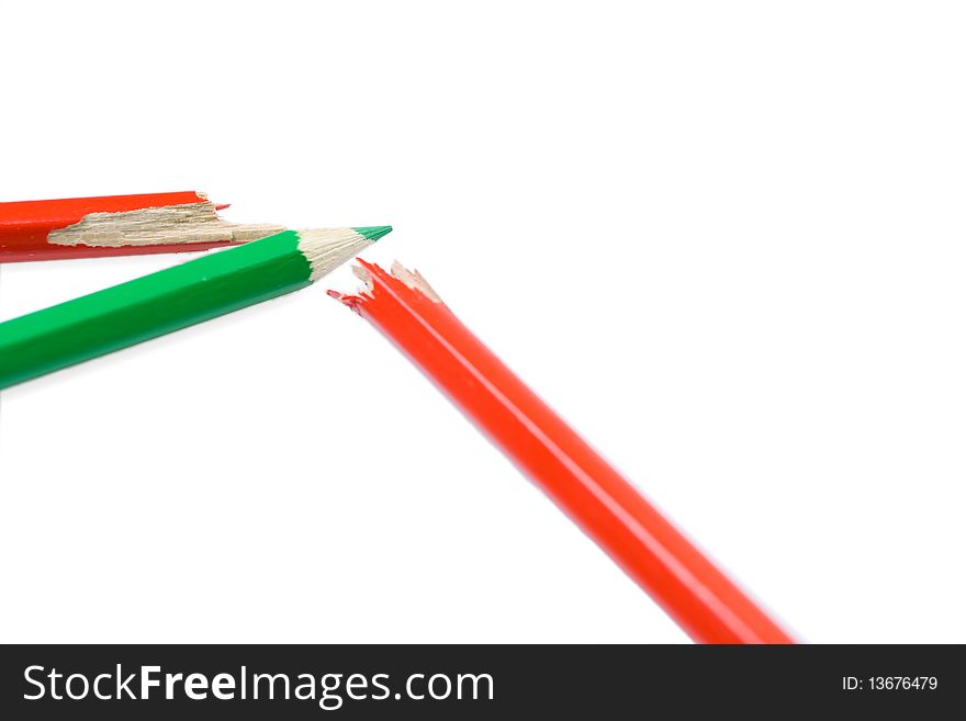 Diagram made of crayons as a stock market's suppression. Isolated on white background. Shallow dof with focus on end of green pencil. Diagram made of crayons as a stock market's suppression. Isolated on white background. Shallow dof with focus on end of green pencil.