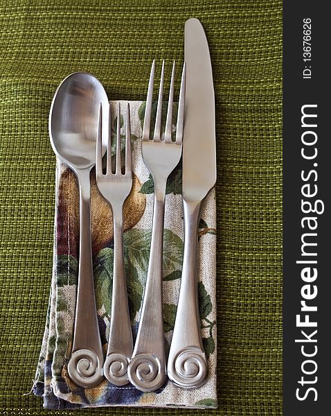 Silverware on napkin and table cloth. Silverware on napkin and table cloth