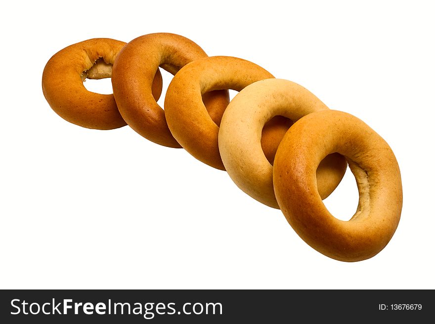 Five fresh bagels laying on a white background-isolated