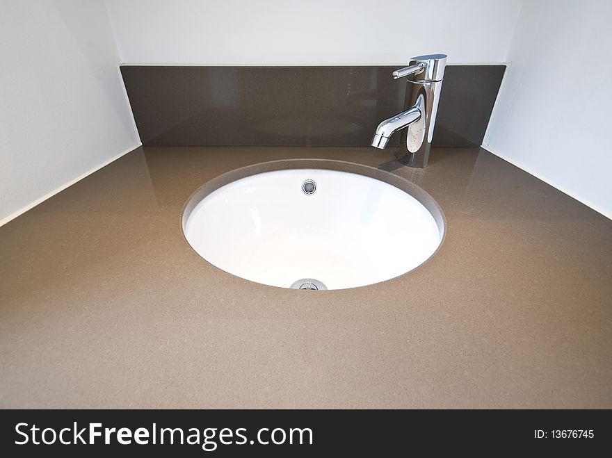 Detail of a modern designer granite wash basin