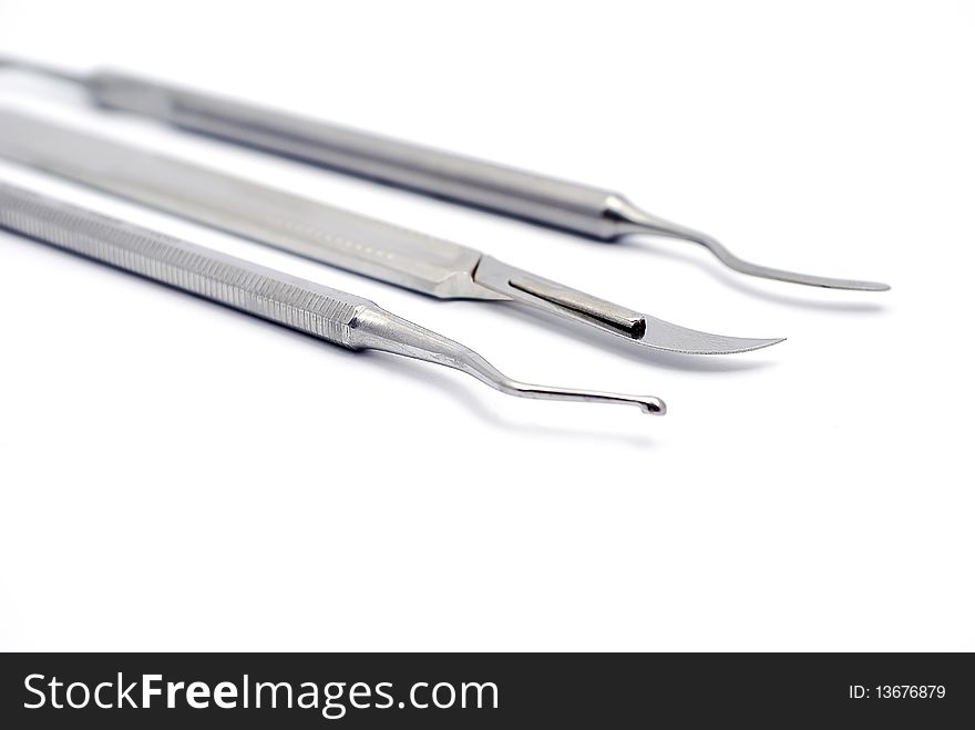 Tools dentist consisting of scalpel, plugger and escalator. Tools dentist consisting of scalpel, plugger and escalator