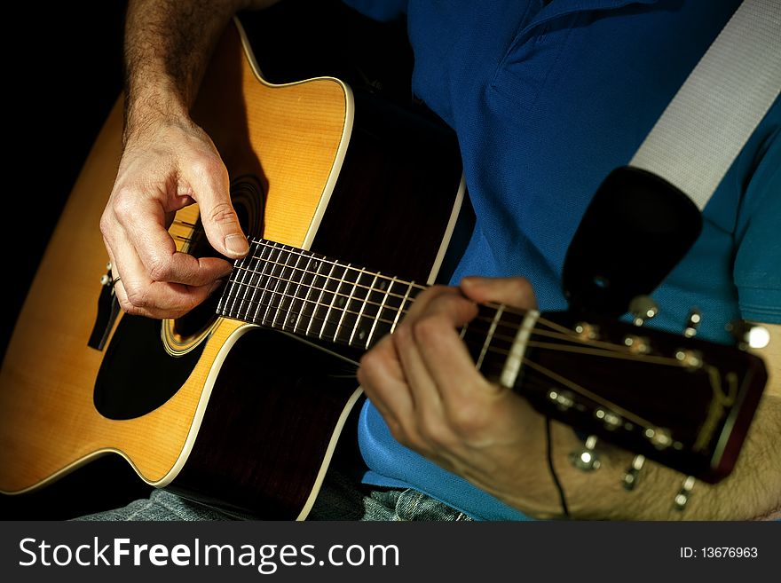 Close up on the chord while a musician plays guitar. Close up on the chord while a musician plays guitar