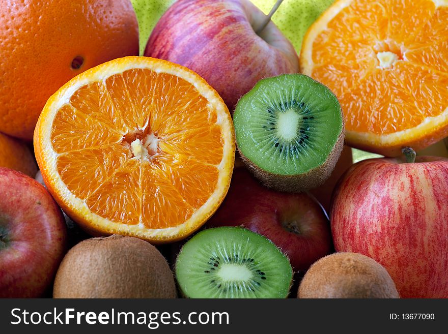 Orange, Apple, Kiwi Fruits Background full Frame. Orange, Apple, Kiwi Fruits Background full Frame