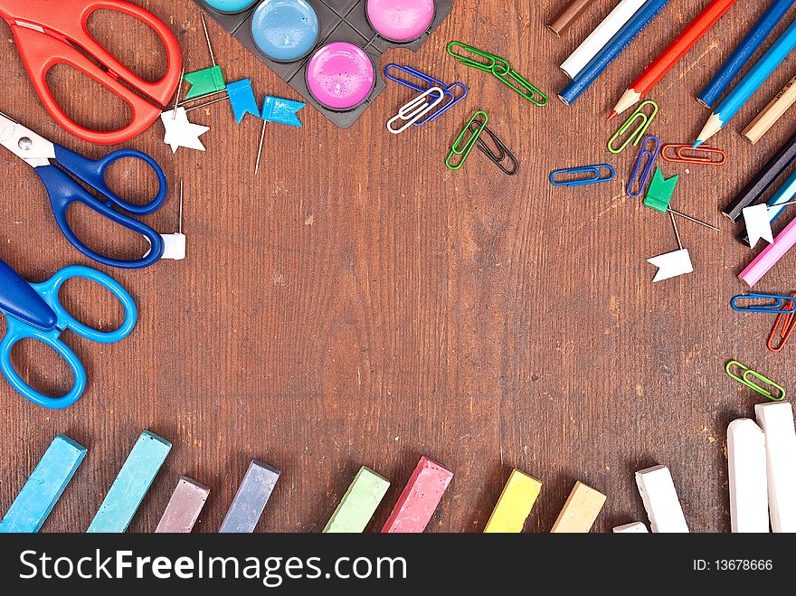 Office tools on wooden board