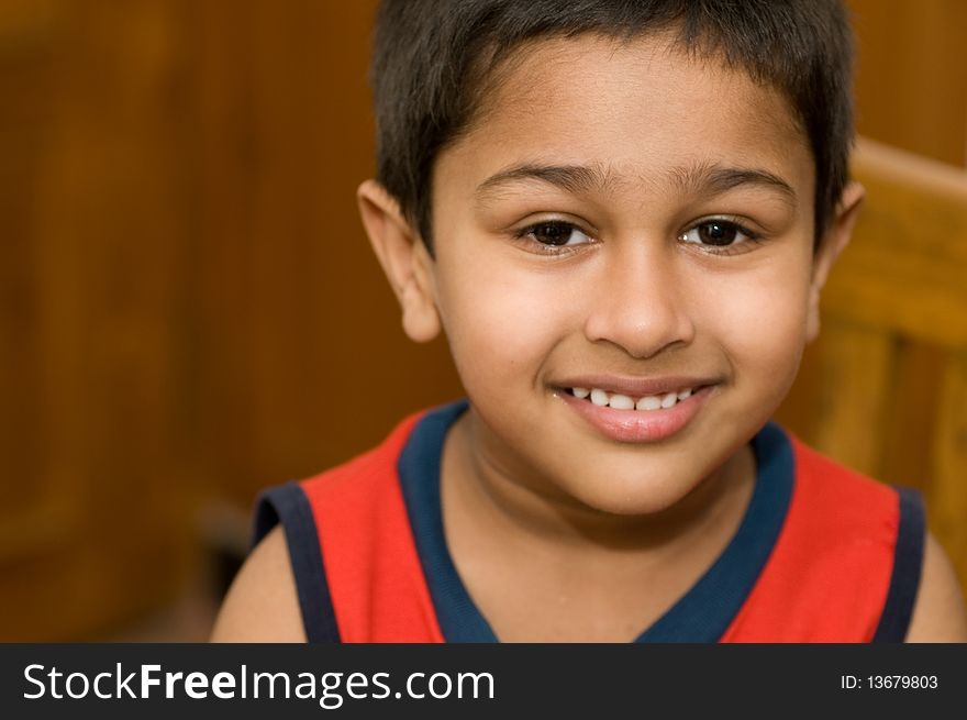 An handsome Indian kid smiling