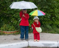 Children With Umbrellas Royalty Free Stock Image