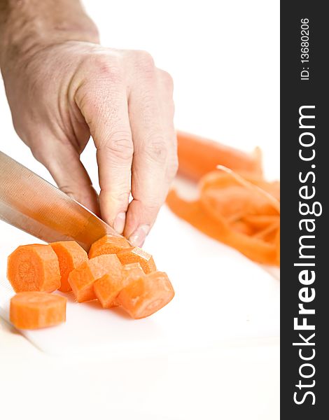 Orange carrot been slided and diced in a kitchen. Orange carrot been slided and diced in a kitchen