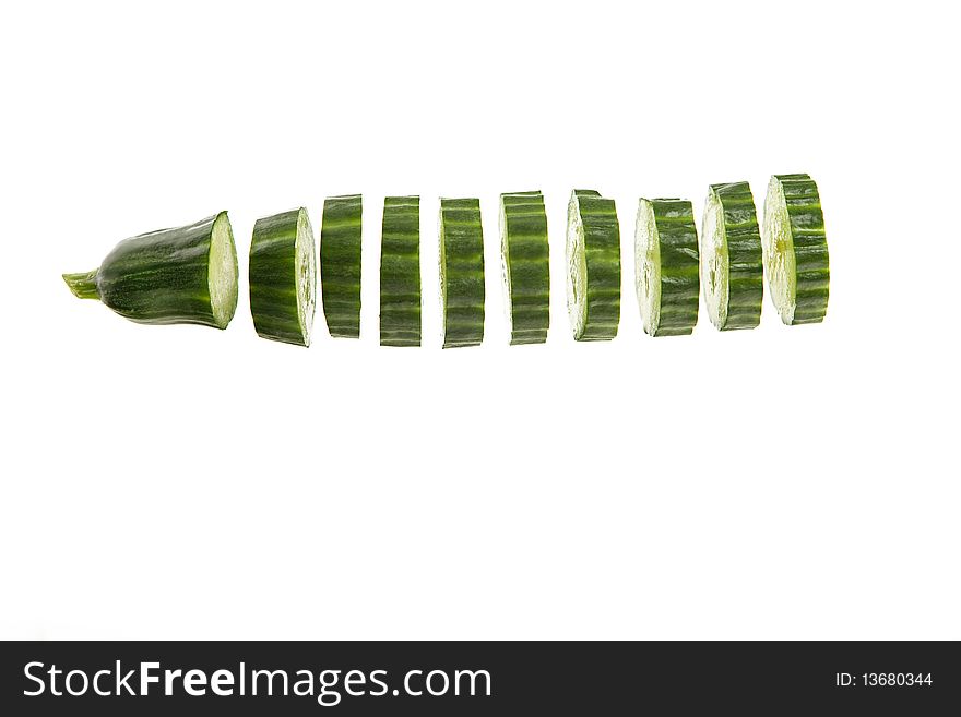 Sliced fresh green cucumber on a white background. Sliced fresh green cucumber on a white background